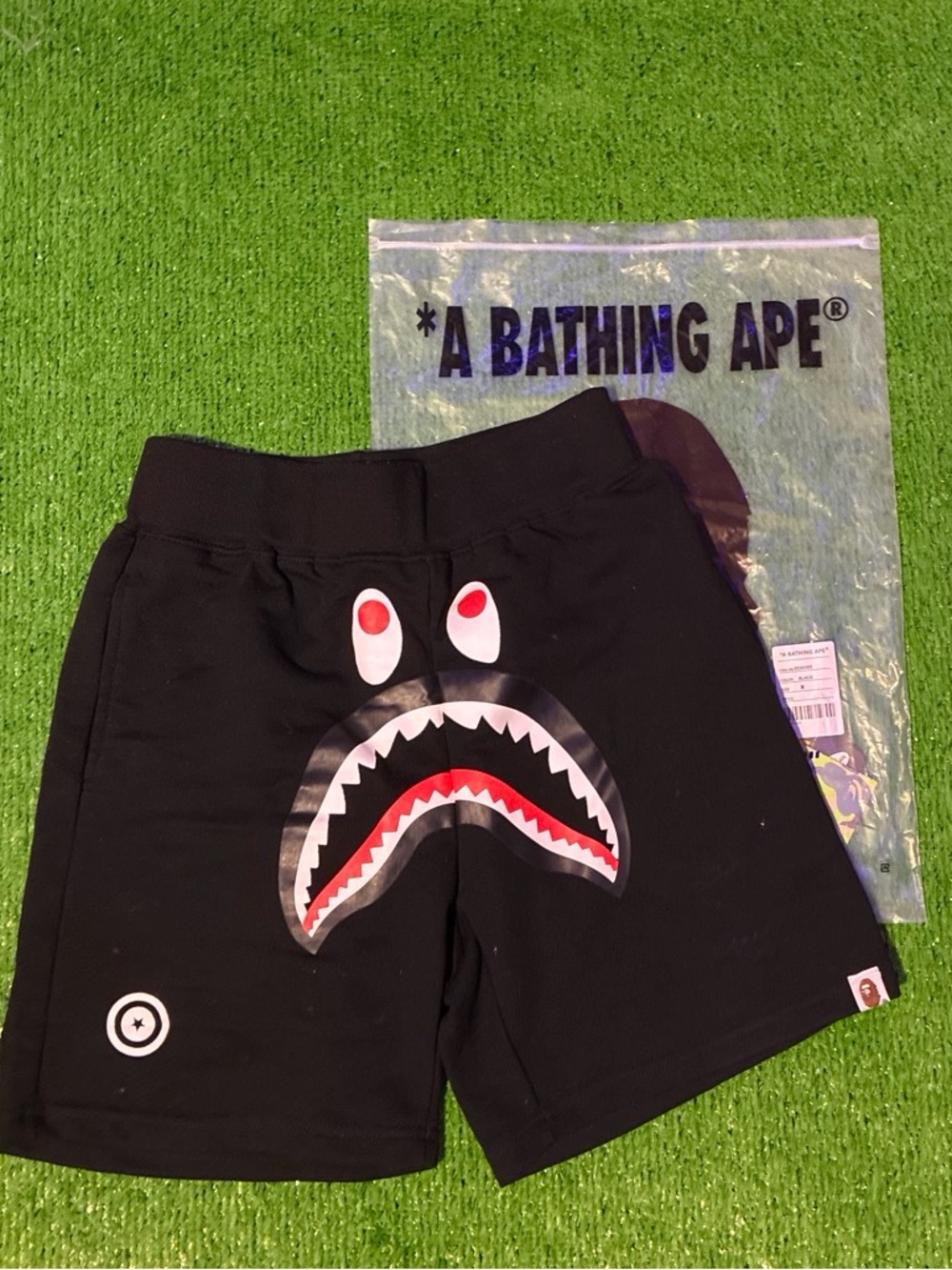 Bape Black Shark Face Graphic Shorts with Red & White Details